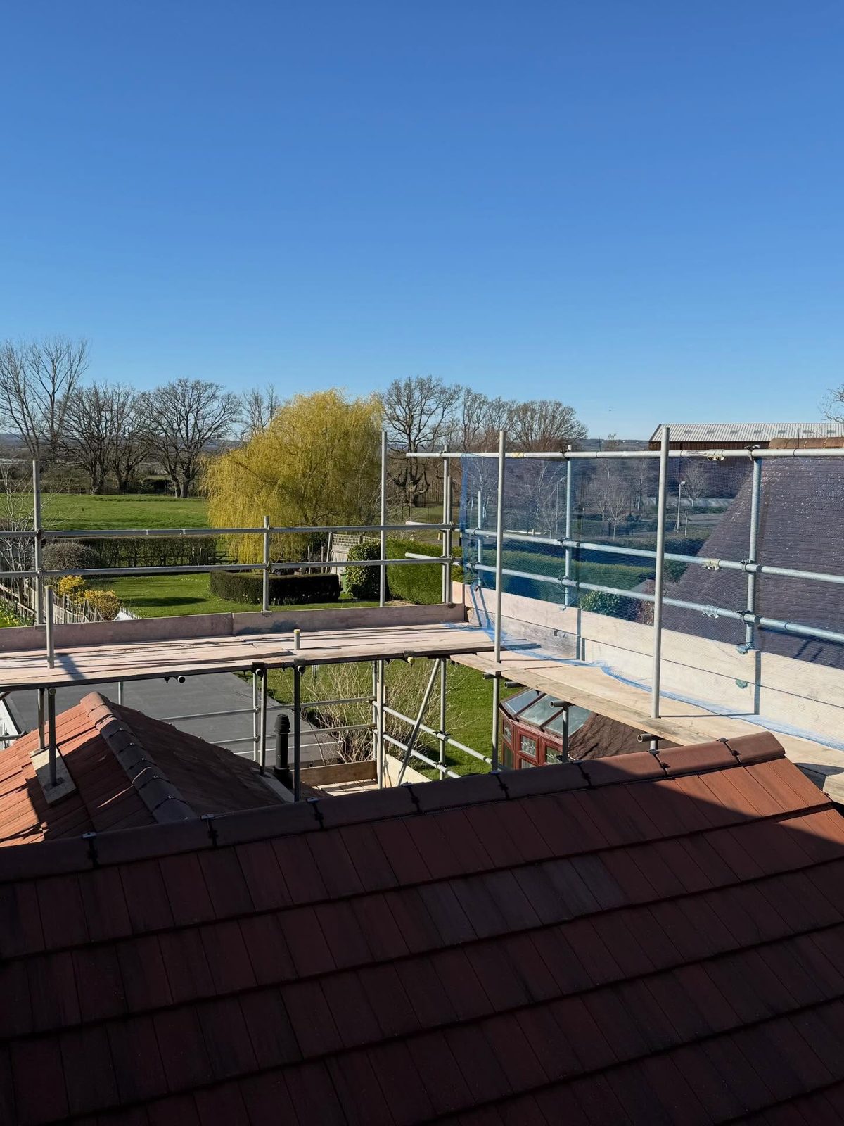 Fully boarded working platform at roof level over the Weald
