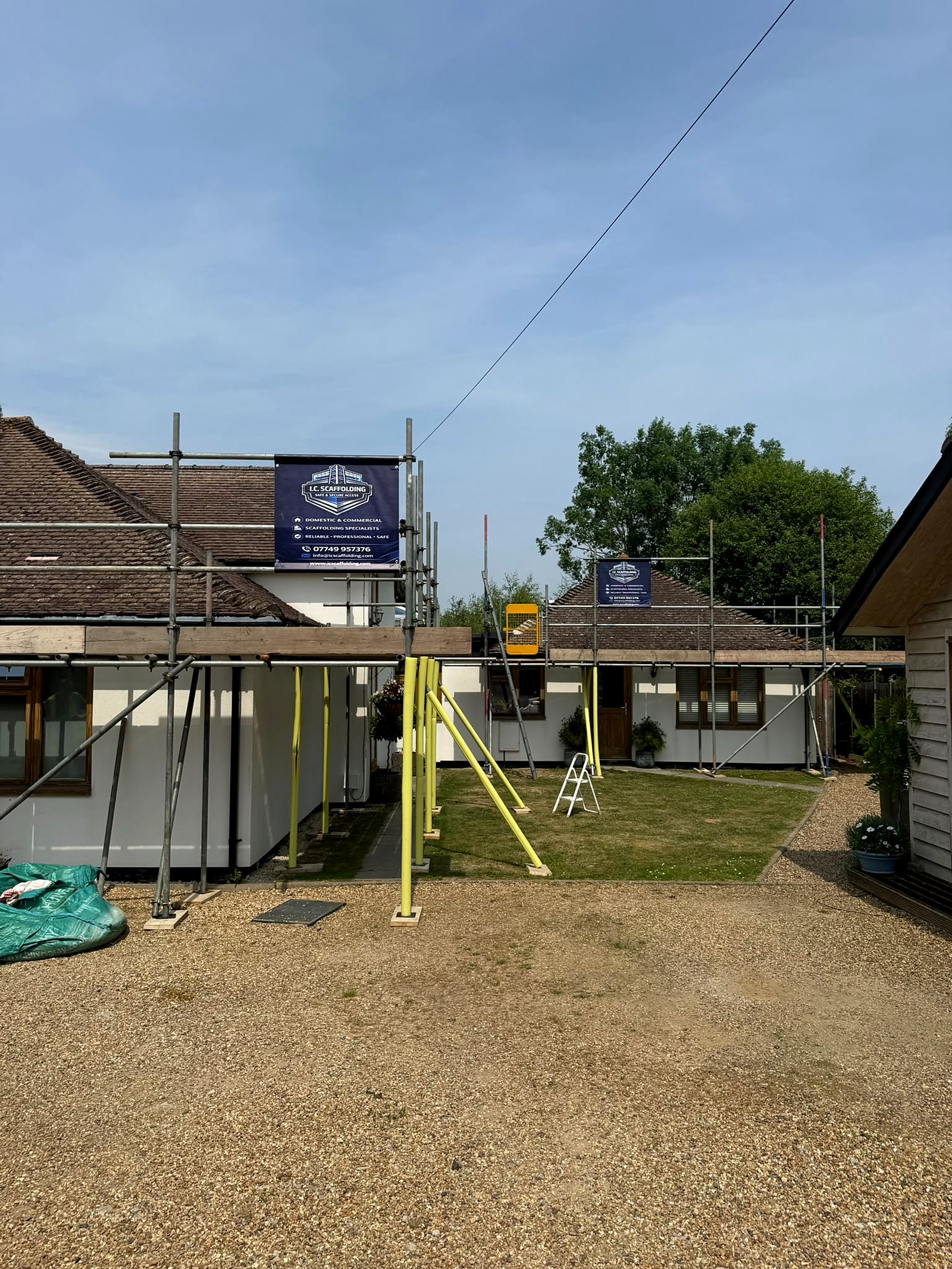 Two runs of scaffold on one job, banners up